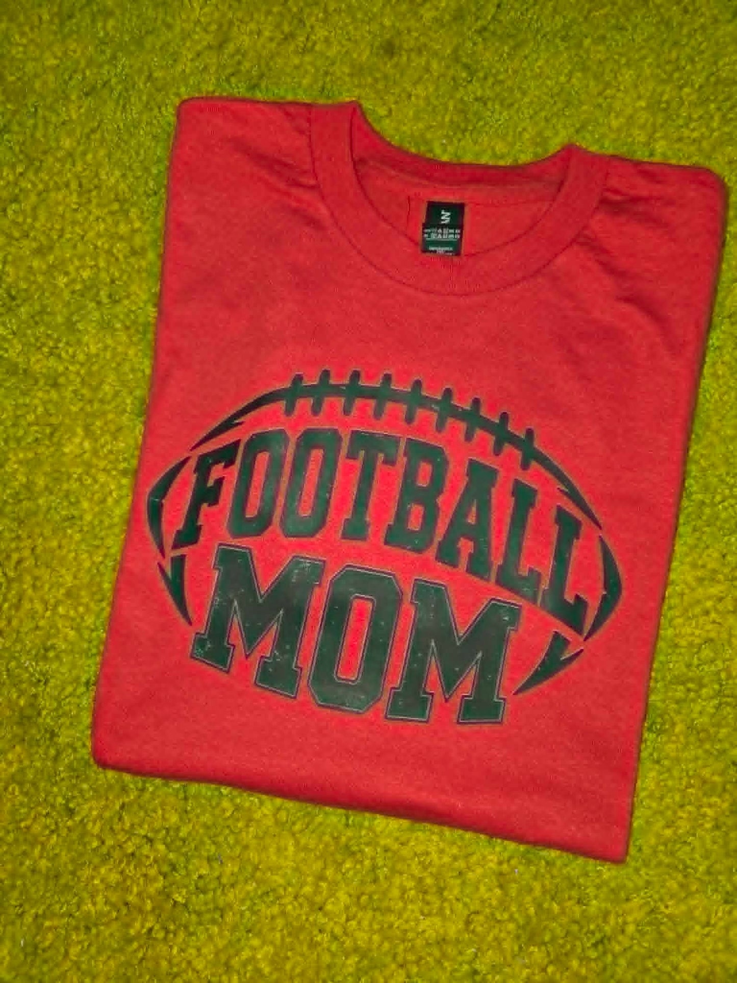 Red Football Mom shirt with distressed black football graphic