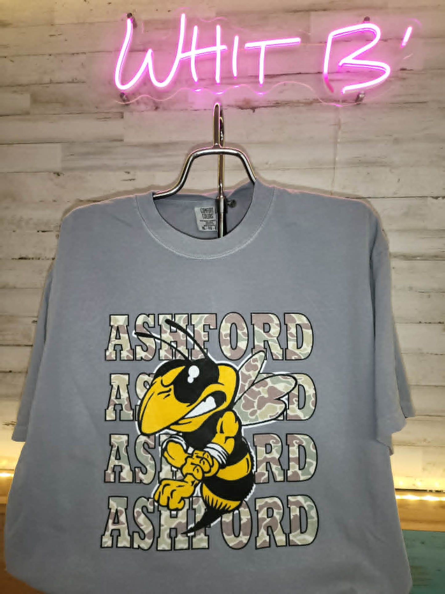 Gray Ashford shirt with camouflage lettering and Yellow Jacket mascot