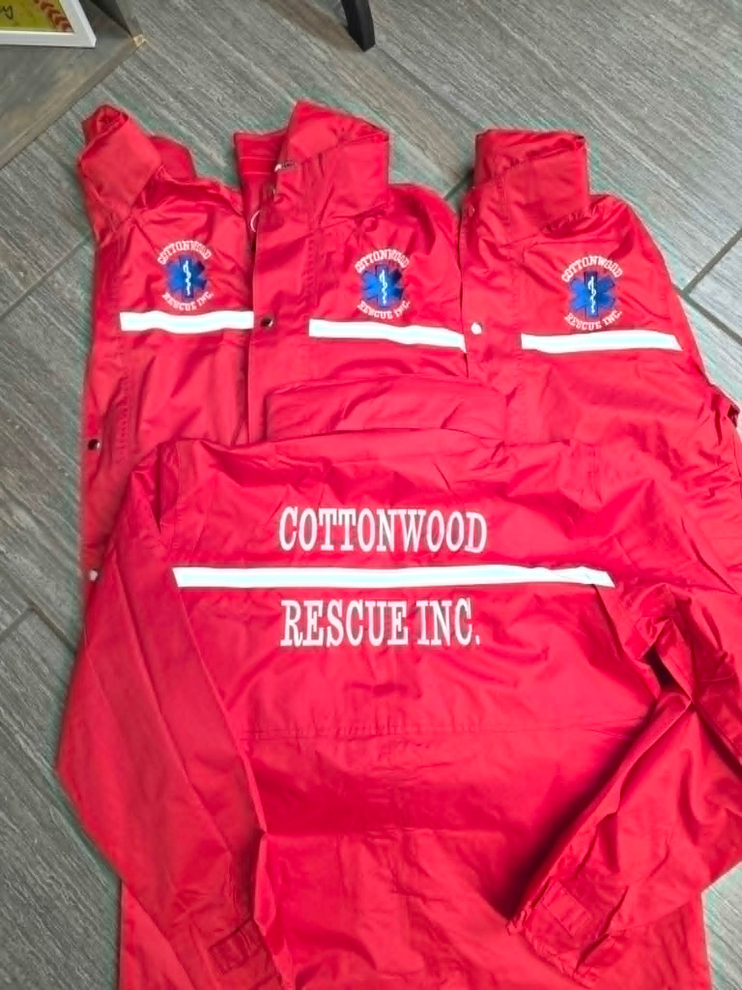 Red Cottonwood Rescue jackets with front logo embroidery and reflective striping