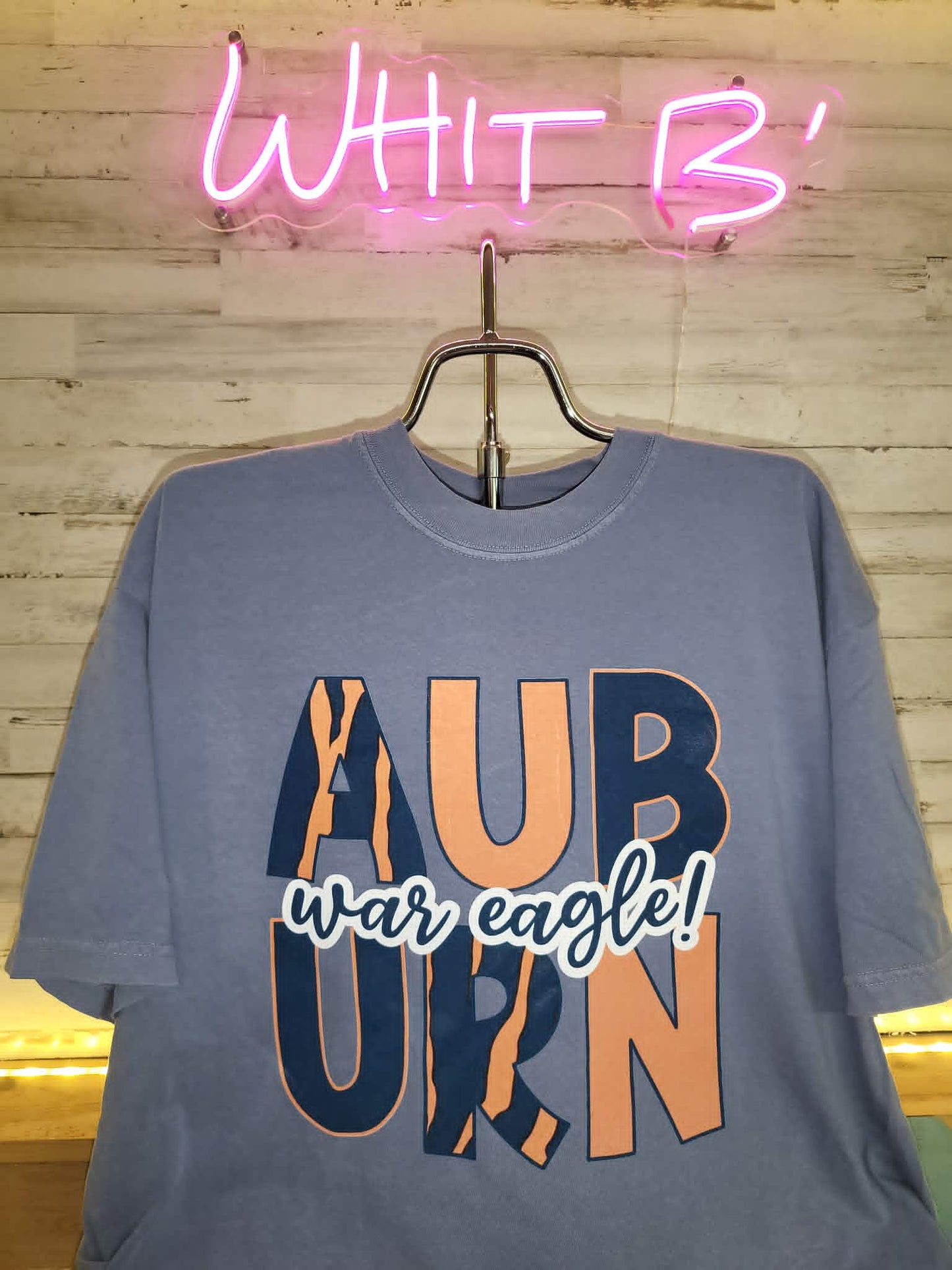 Blue Auburn War Eagle shirt with orange and navy patterned block letters