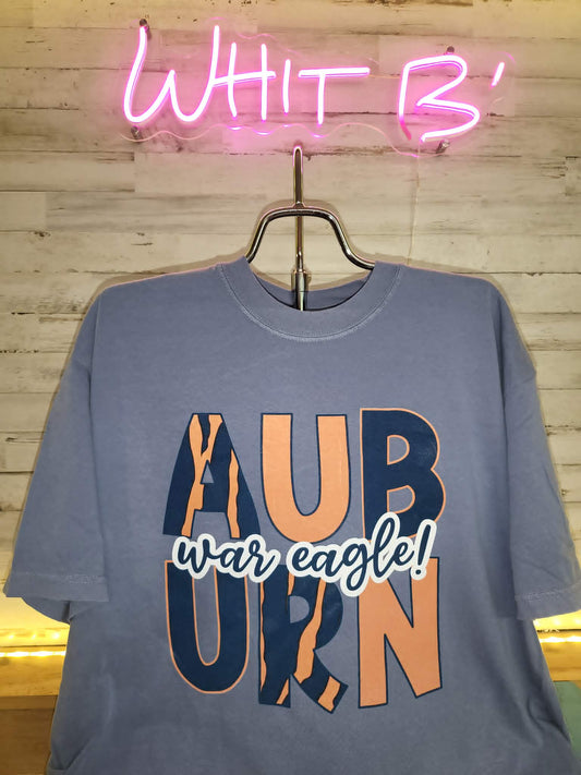 Blue Auburn War Eagle shirt with orange and navy patterned block letters
