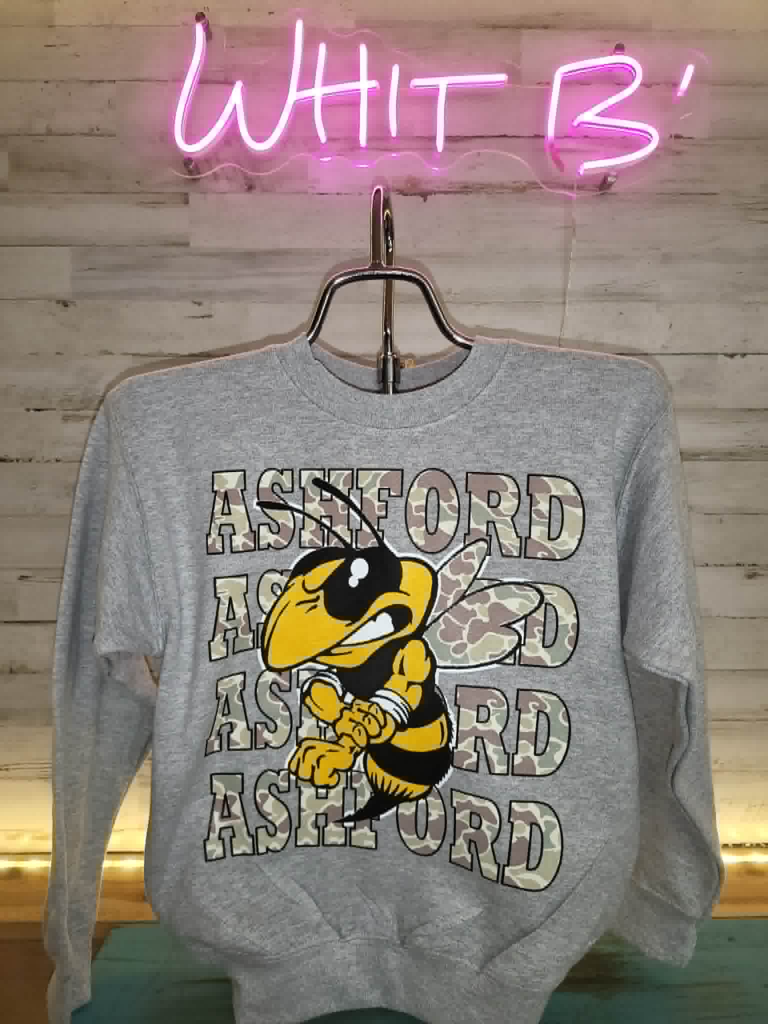 Gray long-sleeve Ashford shirt with camouflage lettering and Yellow Jacket mascot
