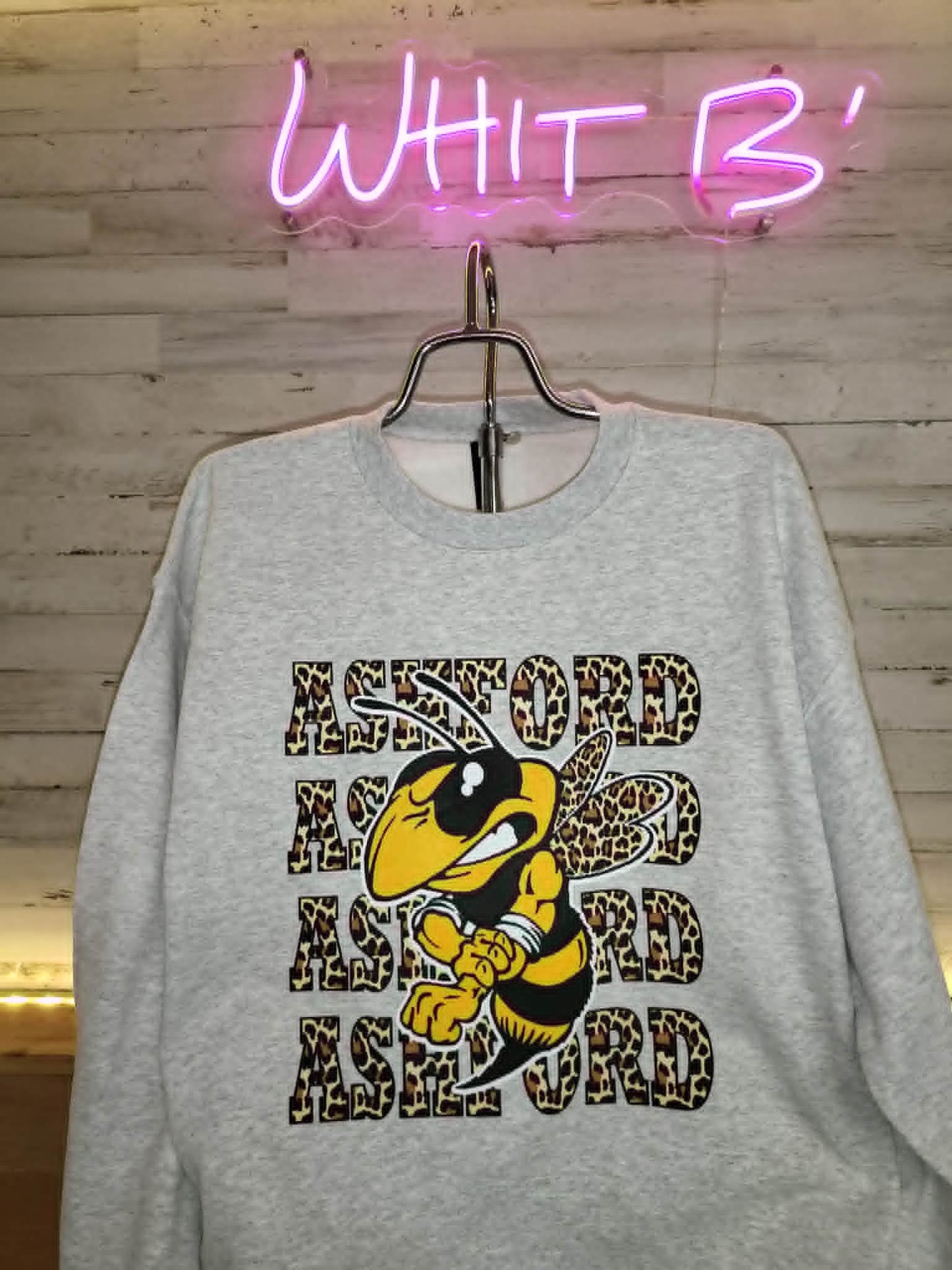 Light gray Ashford sweatshirt with leopard lettering and Yellow Jacket mascot