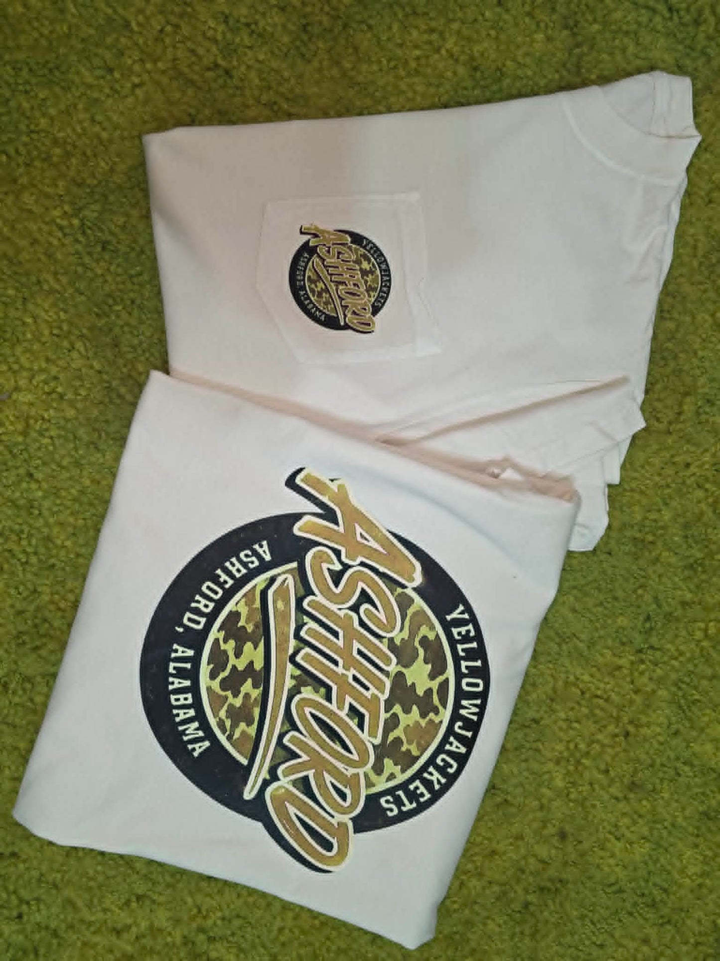 White Ashford Yellow Jackets shirt with small pocket graphic and large camouflage back design