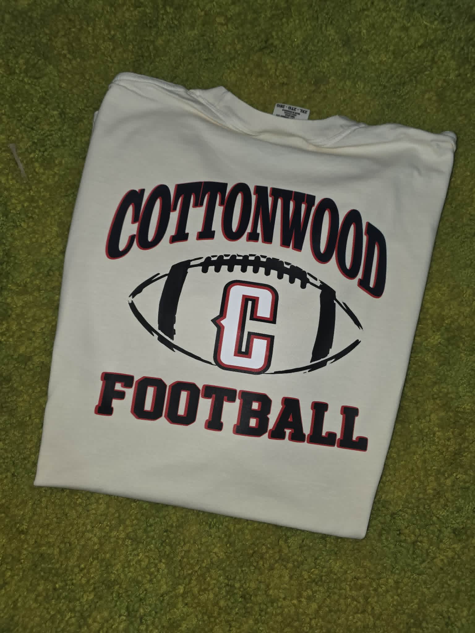 White Cottonwood football shirt with black and red lettering and C logo