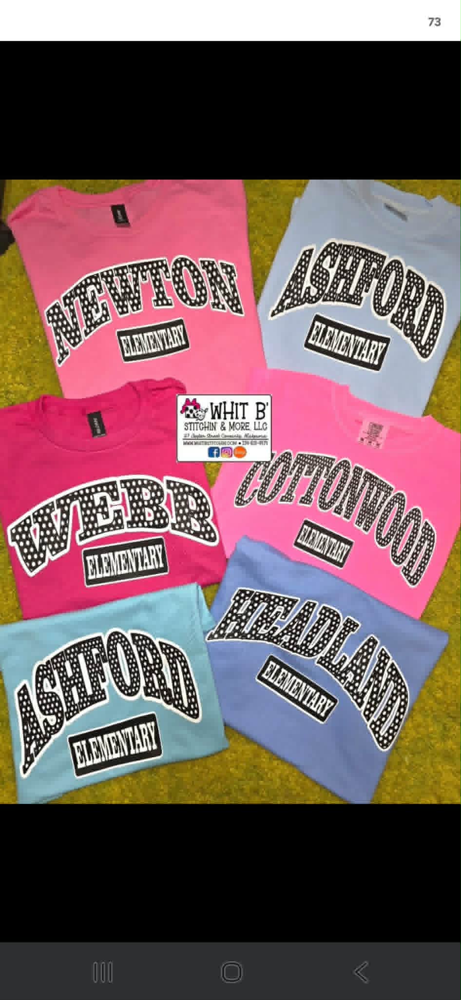 Custom elementary school shirts in pink, blue, and purple with black-and-white varsity lettering