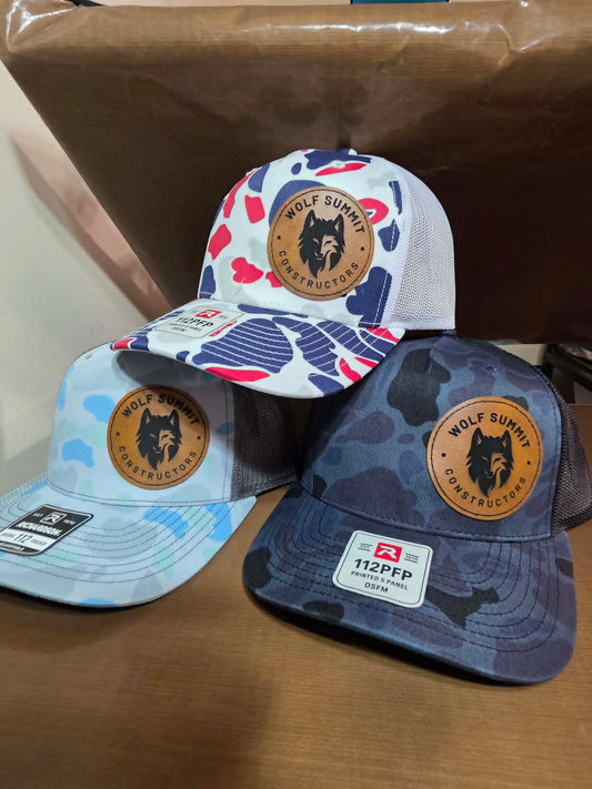 Patterned and camouflage mesh hats with round Wolf Summit Constructors leather patches