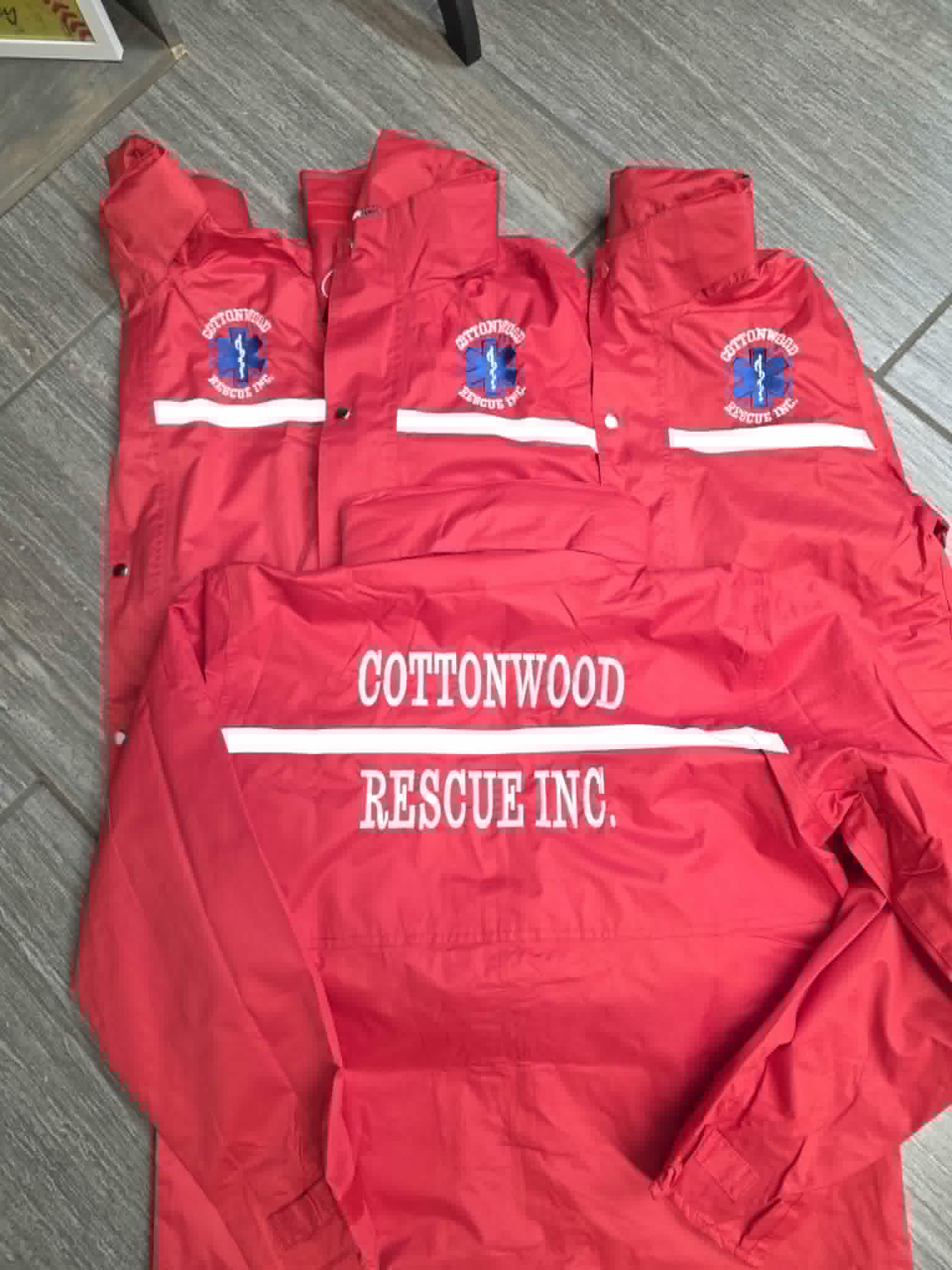 Red Cottonwood Rescue jackets with front logo embroidery and reflective striping