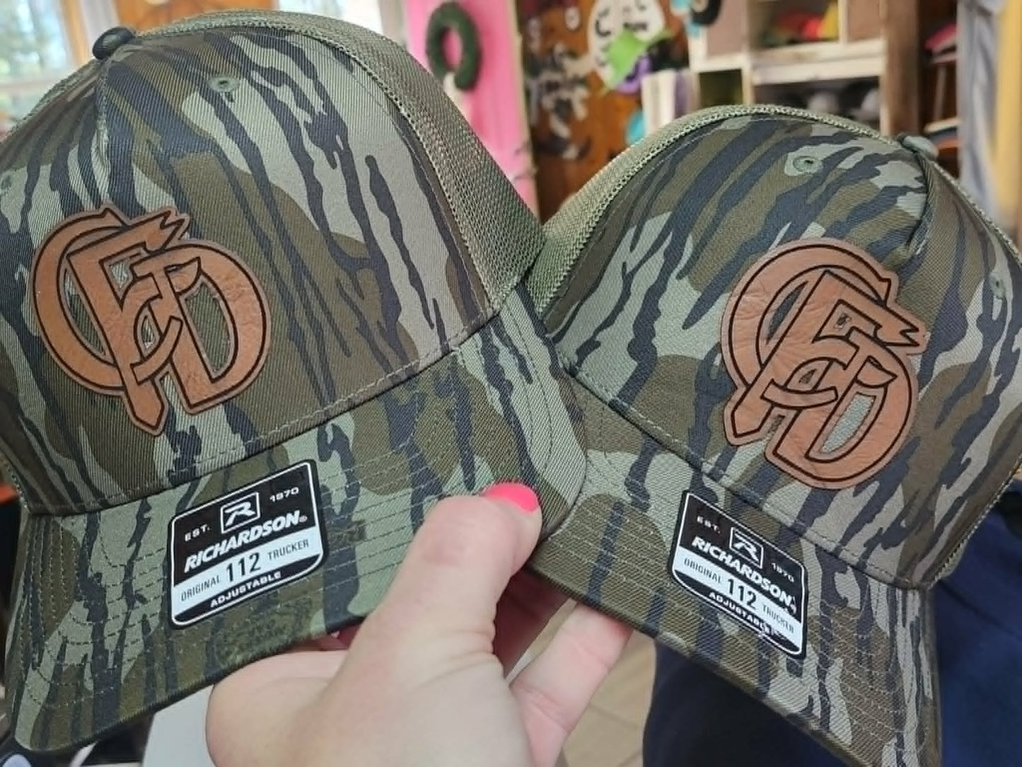 Camouflage Richardson hats with interlocking custom initial leather patches