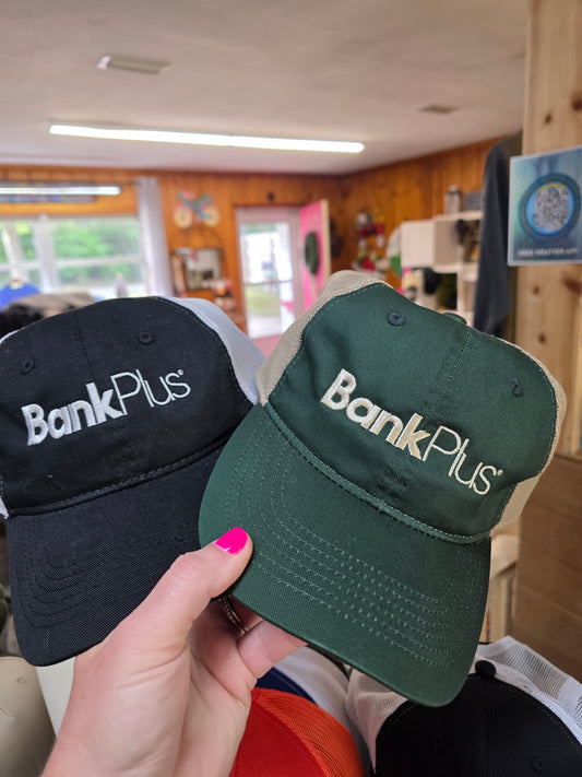 Black and green mesh trucker hats embroidered with the BankPlus logo